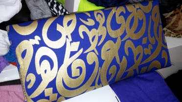 Arabic letters inscribed on shirts, scarves and handbags are seen by many a way to reflect Arab culture. (Al Arabiya)