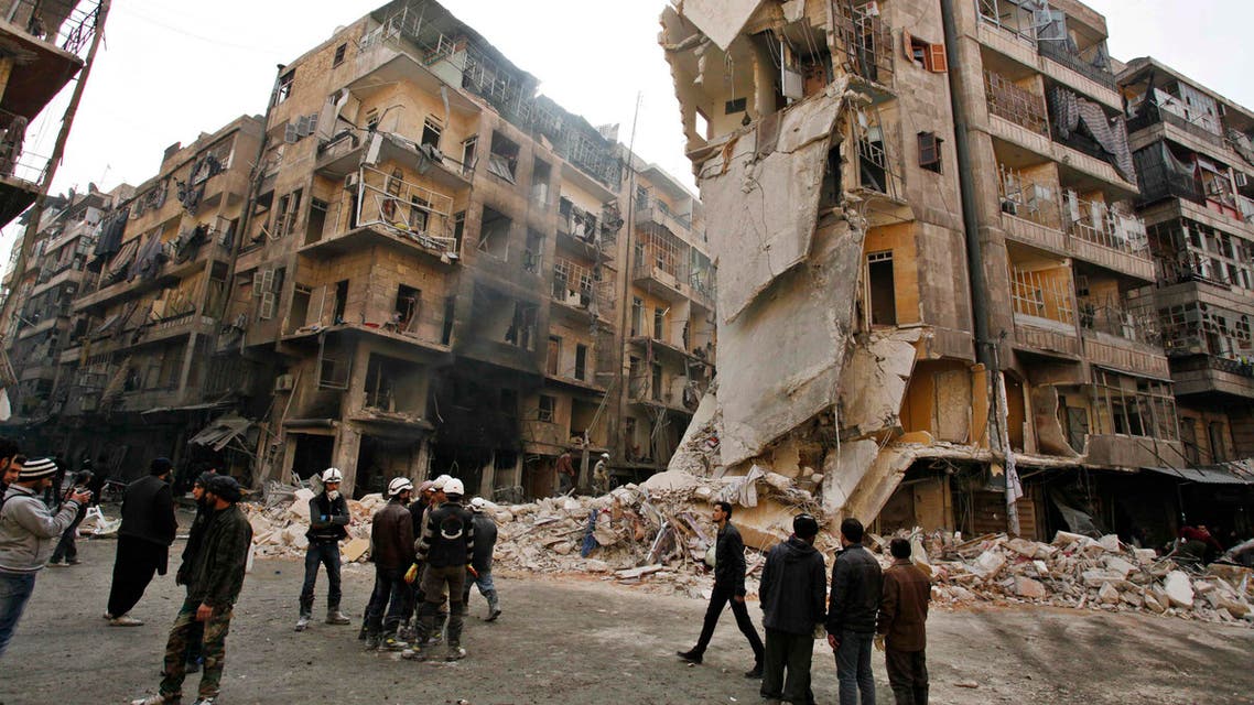 A general view showing damages after what activists said was an airstrike with explosive barrels from forces loyal to President Bashar al-Assad in Al-Shaar area in Aleppo December 17, 2013.