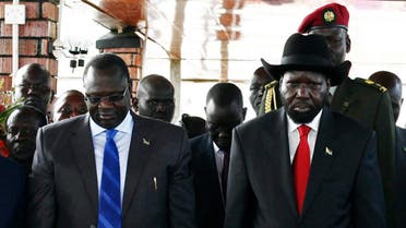 South Sudan's then Vice-President Riek Machar (L) and President Salva Kiir pay their respects at John Garang's Mausoleum, during the celebration of the second anniversary of South Sudan becoming an independent state, in Juba, in this July 9, 2013 file photo. 
