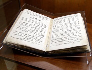 A book written in Aramaic is seen in a glass case at the Museum of St. George's Catholic Church in Kormakitis, Cyprus May 9, 2010.