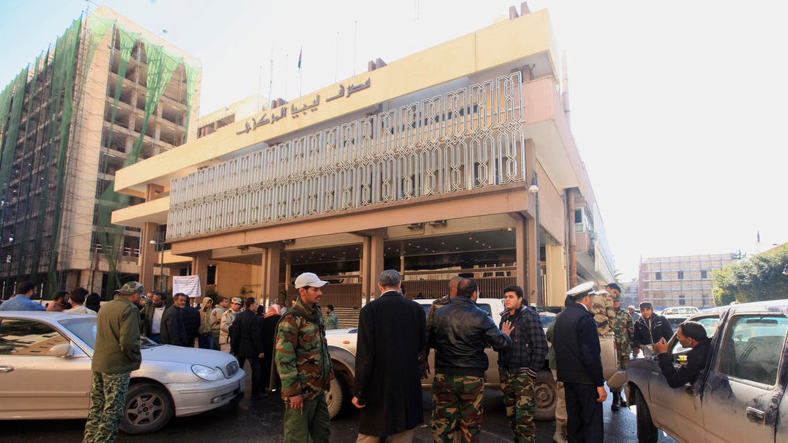 Members of the Libyan National Army stand in front of the Central Bank of Libya. (File photo: Reuters)