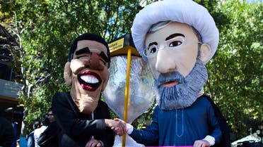 Members of international advocacy group Avaaz take part in a protest wearing masks of Iran's new President Hassan Rowhani (R) and U.S. president Barack Obama, outside the U.N. headquarters in New York Sep. 24, 2013. (File photo: Reuters)