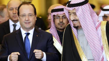 Saudi Arabia’s Crown Prince Salman bin Abdul Aziz al-Saud (R) walks alongside French President Francois Hollande (L) following a meeting with Saudi businessmen in Riyadh on Dec. 30, 2013. (AFP)
