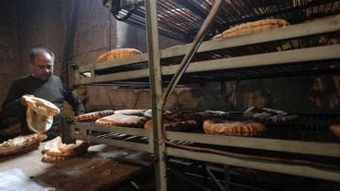 A man works at a bakery in Aleppo city December 30, 2013. (Reuters)
