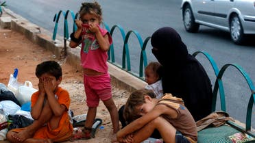 Homeless Syrian children are seen along a street in Beirut July 22, 2013. (Reuters) 