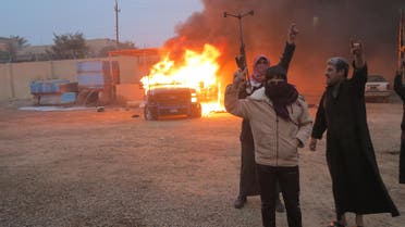 Protesters burn a police vehicle during fighting in Ramadi Dec. 31, 2013. Fighting erupted when Iraqi police broke up a Sunni Muslim protest camp in the western Anbar province on Monday, leaving at least 13 people dead, police and medical sources said. (Reuters)
