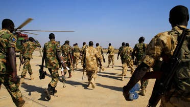 South Sudan army soldiers walk to board a military helicopter at Juba international airport, before heading to Bor, 180km (108 miles) northwest from the capital December 25, 2013. reuters