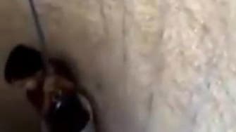 Video of man lowering child into well stirs controversy