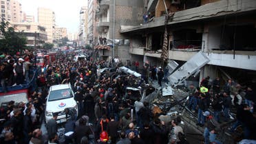 People gather at the site of an explosion in Beirut's southern suburbs, Jan. 2, 2014. (Reuters)