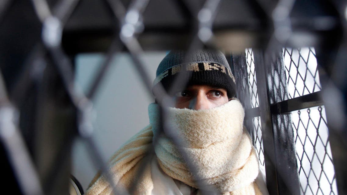 A suspected al Qaeda militant appears behind bars at the state security court of appeals in Sanaa March 26, 2013.