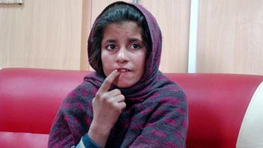 An Afghan girl named Spozhmai is held in a border police station in the southeastern part of Helmand province, Afghanistan. 