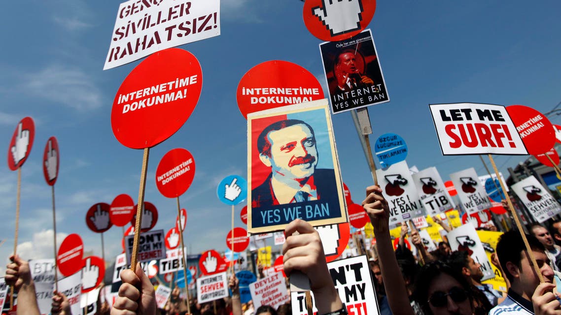 Demonstrators hold placards with some featuring a picture of Turkey's Prime Minister Tayyip Erdogan during a protest against internet censorship in Istanbul May 15, 2011. reuters