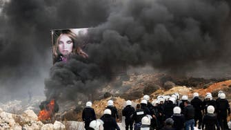 Palestinian police, refugee camp residents clash over U.N. strike