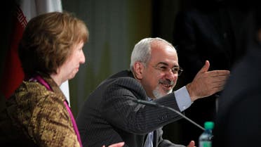 Iranian Foreign Minister Mohammad Javad Zarif (R) speaks next to European Union foreign policy chief Catherine Ashton during a news conference at the end of the Iranian nuclear talks in Geneva November 10, 2013.