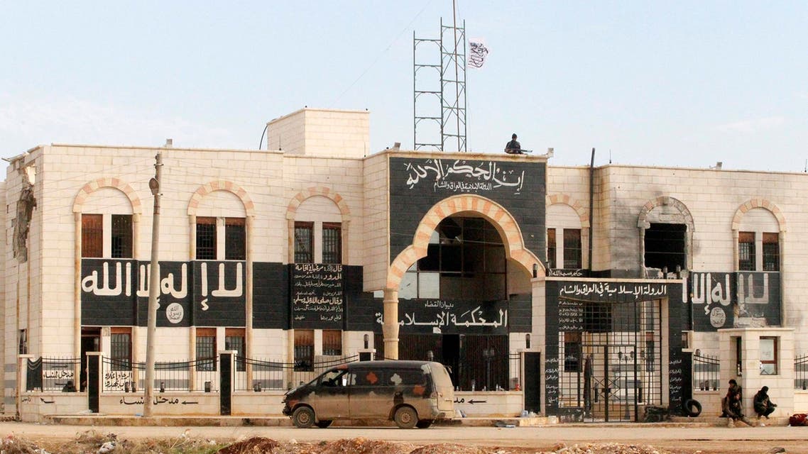 Rebel fighters stand guard at a former base used by fighters from the Islamic State in Iraq and the Levant (ISIS), after they captured it from the ISIS in al-Dana town in Idlib province, Jan. 9, 2014. (Reuters)