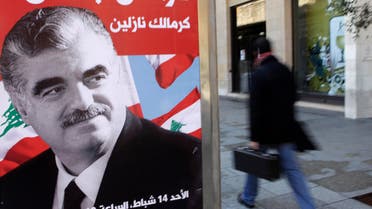 A man walks past a poster depicting Lebanon's assassinated former prime minister Rafik al-Hariri, in downtown Beirut February 10, 2010. reuters