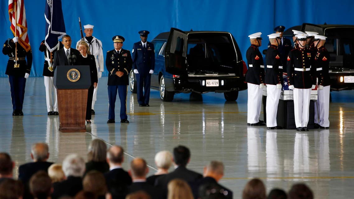 U.S. President Barack Obama and Secretary of State Hillary Clinton participate in a transfer ceremony of the remains of U.S. Ambassador to Libya, Chris Stevens and three other Americans killed this week in Benghazi, at Andrews Air Force Base near Washington,