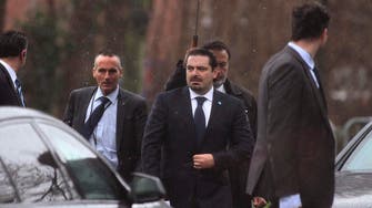 Hariri says could share power with Hezbollah