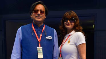 Sunanda Puskhar Tharoor (R), wife of India’s Minister of State for Human Resource Development Shashi Tharoor, poses with her husband at the Indian F1 Grand Prix at the Buddh International Circuit in Greater Noida, on the outskirts of New Delhi, Oct. 27, 2013. (Reuters)