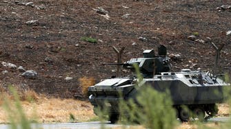 Turkey patrols Syria border, wary of weapon trade 