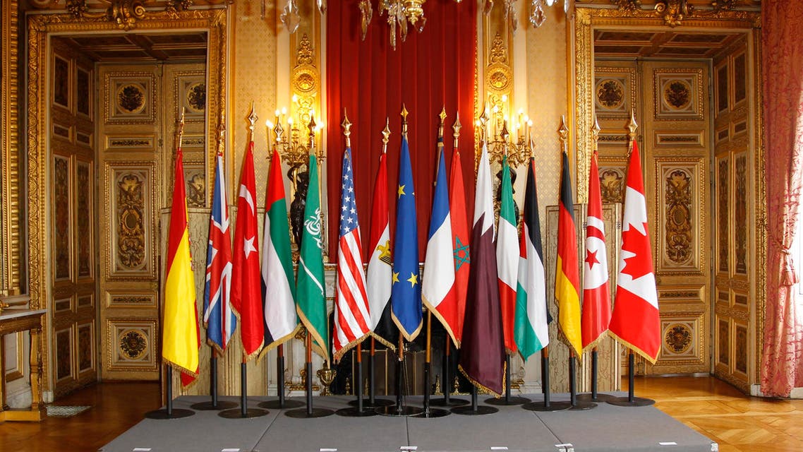 Flags are seen prior to the family photo at the meeting, "The Friends of Syria" in Paris April 19, 2012. (Reuters)