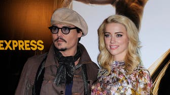 Magazine says Johnny Depp engaged to wed Amber Heard 