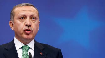 Turkey’s Erdogan, on Brussels visit, criticized over crackdown