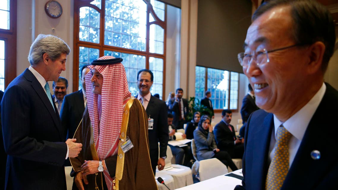 U.S. Secretary of State John Kerry (L) talks to Saudi Arabia's Foreign Minister Prince Saud al-Faisal (2nd L) as U.N. Secretary-General Ban Ki-moon (R) walks past prior to the Geneva-2 peace talks in Montreux Jan. 22, 2014. (Reuters)