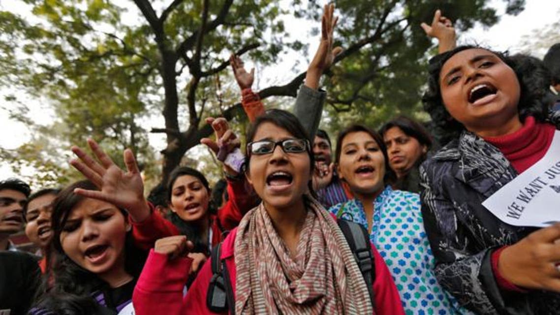 Demonstrators shout slogans and raise their hands during a protest for a gang rape victim in New Delhi January 16, 2013.