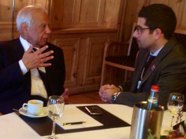 Egyptian PM Hazem el-Beblawi, left, speaks with Al Arabiya News Editor-in-Chief Faisal J. Abbas in Davos. (Al Arabiya)