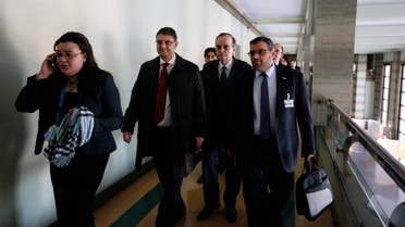 Syrian opposition delegation arrive for a meeting with U.N.-Arab League envoy for Syria Lakhdar Brahimi (not seen) at a U.N. office in Geneva Jan. 24, 2014. (Reuters)