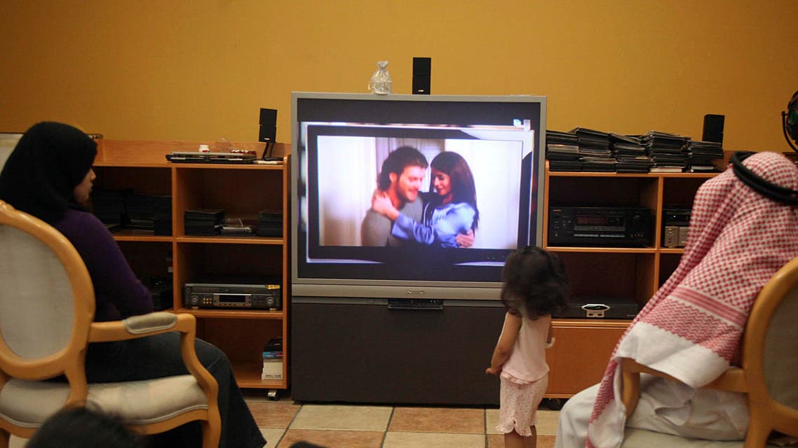 A family watches the Turkish soap opera "Noor" in Jeddah July 26, 2008. reuters