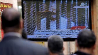 Mursi yells in court during Egypt prison break trial 