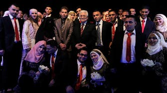 Palestinian leader presides over mass wedding