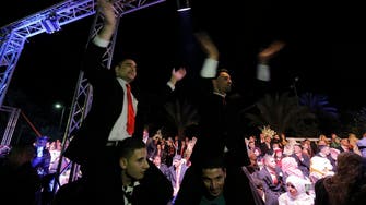 Palestinians attend mass wedding ceremony