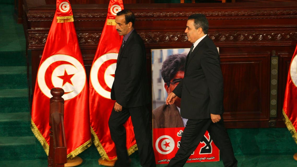 Tunisia's Prime Minister Mehdi Jomaa (C) arrives to deliver a speech in the constituent assembly and present his government in Tunis January 28, 2014.