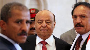 Yemen's President Abd-Rabbu Mansour Hadi (C) enters the hall during the closing ceremony of the national dialogue conference in Sanaa January 25, 2014.