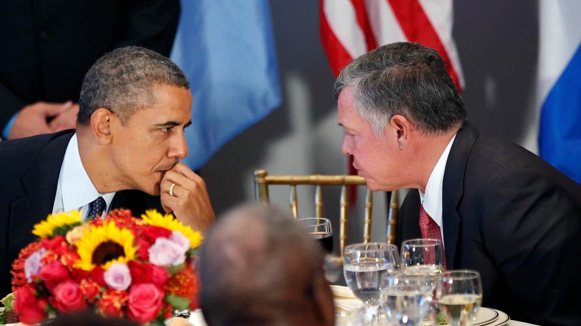 U.S. President Barack Obama talks with Jordan's King Abdullah (R) during a luncheon at the United Nations General Assembly in New York September 24, 2013.