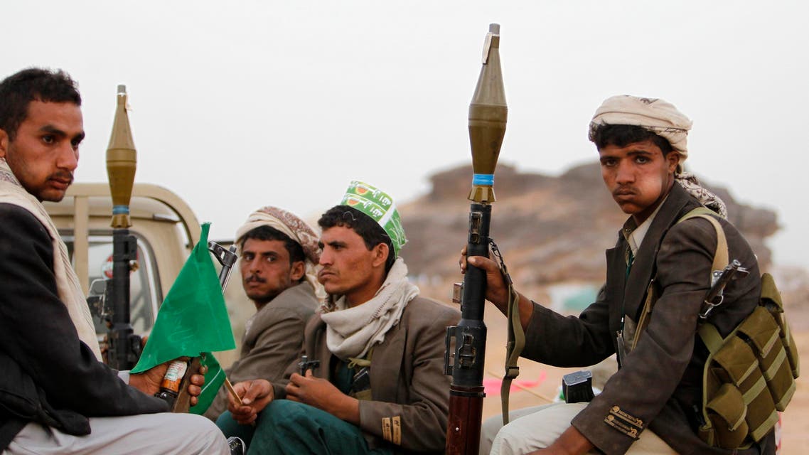 Armed followers of Yemen's Shi'ite Houthi group sit on a truck patrolling the vicinity of a ceremony attended by fellow Shi'ites in Dhahian of the northwestern Yemeni province of Saada Feb. 3, 2012. (Reuters)