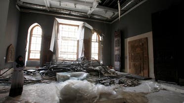 An antiquities restoration engineer looks at the interior of the Islamic Art Museum, which was damaged by a car bomb attack targeting the nearby Cairo Security Directorate on Friday, in downtown Cairo January 26, 2014. reuters
