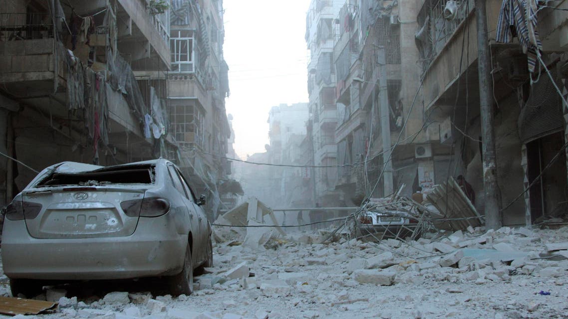 Damaged vehicles are seen amongst debris after what activists said was an air raid by forces loyal to Syrian President Bashar Al-Assad, in Aleppo's district of Al Sukari February 1, 2014. (Reuters)