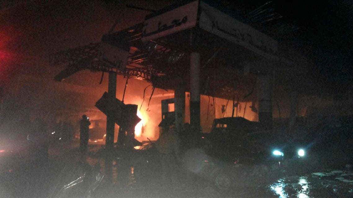 A damaged petrol station is seen at the site of an explosion in the Shi'ite town of Hermel February 1, 2014. (Reuters)