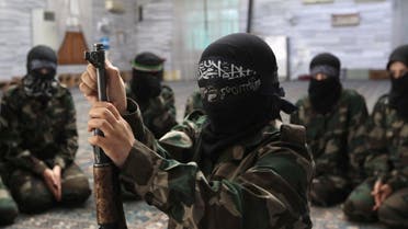 A female member of anther jihadist battalion, the Ahbab Al-Mustafa Battalion, assembles a rifle during military training in a mosque in the Seif El Dawla neighborhood in Aleppo. (File photo: Reuters) 