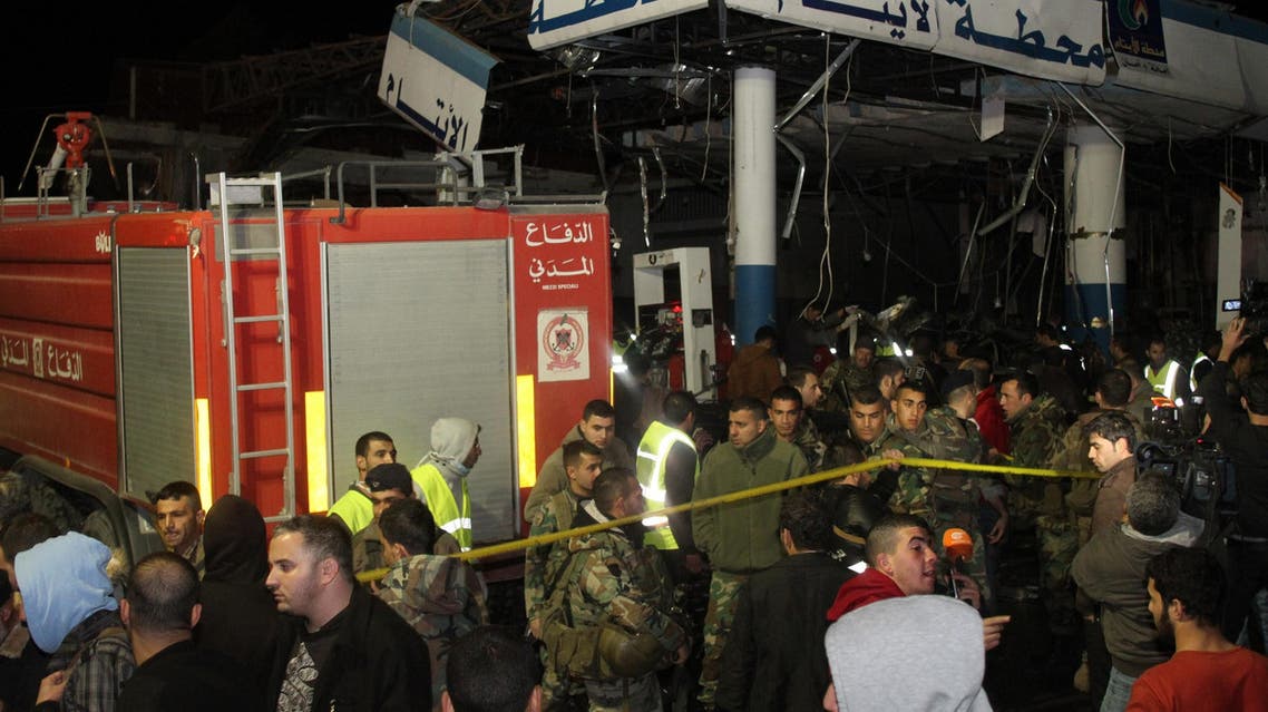 Lebanese emergency personnel are seen at the site of a car bomb explosion targeting a petrol station in eastern Lebanon's town of Hermel on February 1, 2014
