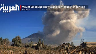 Mount Sinabung spews ash at a village in Indonesia