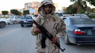 A member of the Libyan army stands guard along a street following a clash in Benghazi Nov.26, 2013. (File Photo: Reuters)