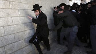 Ultra-orthodox Jews battle Israel police over the draft