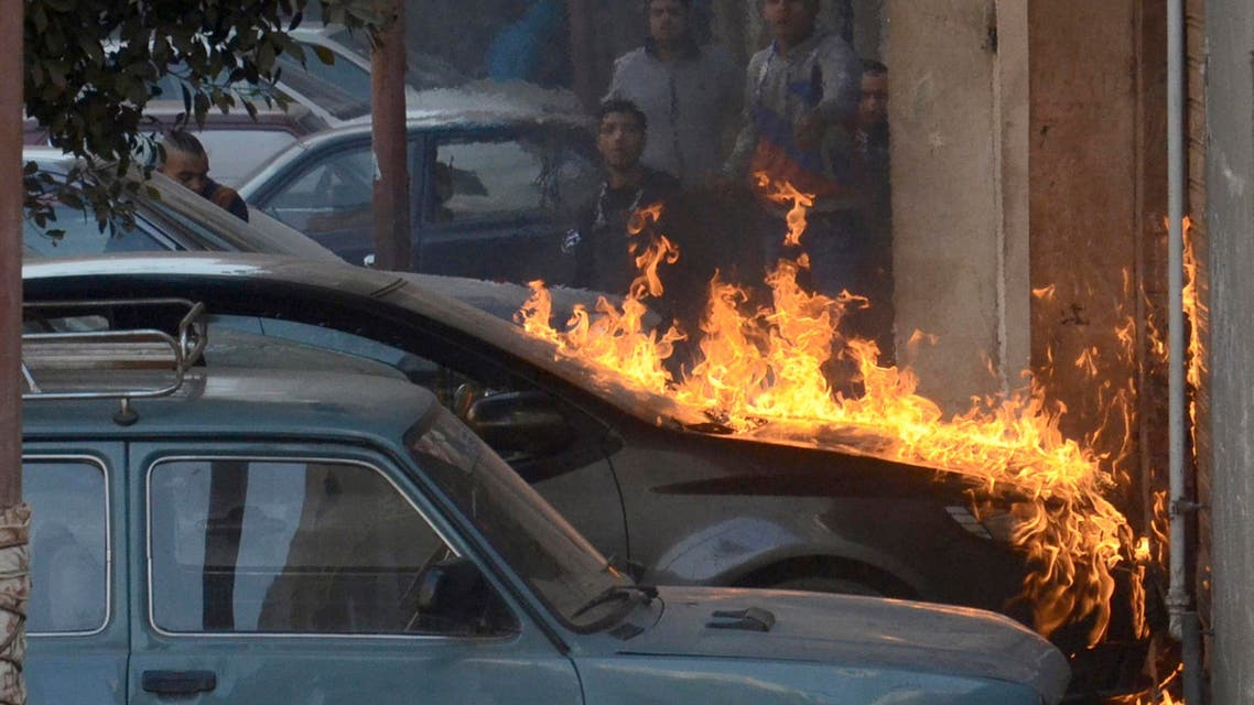 Fire caused by molotov cocktail bombs is seen during clashes between pro and anti-Mursi protesters in the Giza governorate, south of Cairo, Feb. 7, 2014. (Reuters)