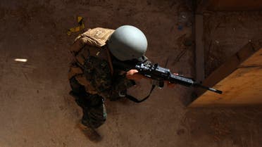 A member of Yemen's U.S.-trained counter-terrorism force takes part in a house raid training near Sanaa reu