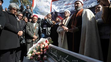 Tunisians marked 12 turbulent months since Belaid was assassinated
